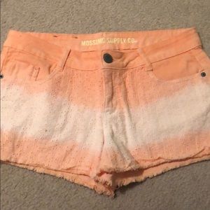 Orange and white lace shorts.